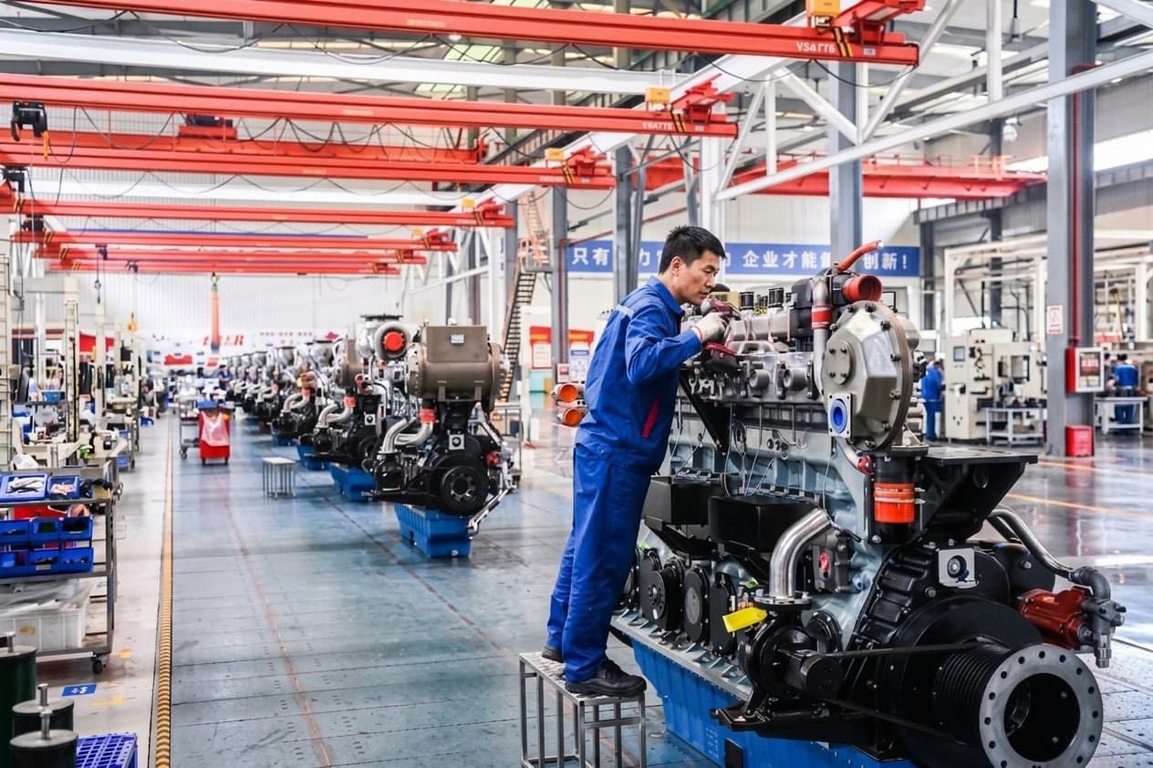 Technician assembling an engine on the KINBOOST line in Weifang