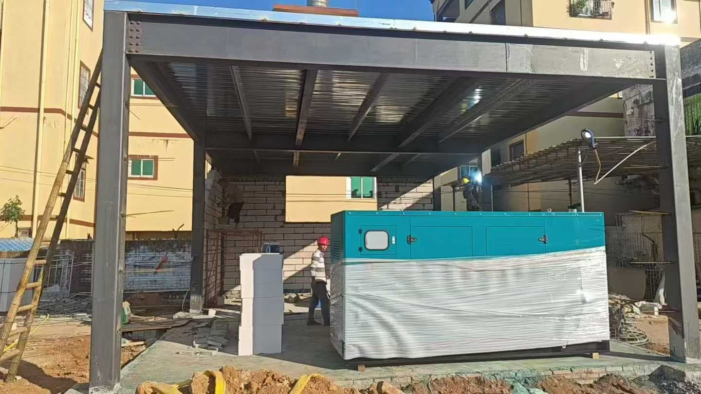 A teal canopy set standing on a concrete pad under a newly erected steel canopy, with a worker beside it